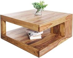 a wooden coffee table with a plant on top