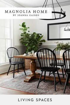 a dining room table and chairs with the words magnolia home by joanna garnes living spaces