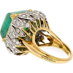 Engage with the spirit of artistic expression and fine craftsmanship in the exquisite David Webb Platinum & 18K Yellow Gold 1960's Green Emerald Sugarloaf Ring. This timeless piece encapsulates the allure of a bygone era, combining the richness of 18K yellow gold with the elegance of platinum. At the heart of this ring rests a genuine green emerald, cut in the distinctive sugarloaf style, surrounded by round cut diamonds in a platinum carriage.The mesmerizing green hue of the emerald is beautifully complemented by the brilliance of the surrounding diamonds, creating a harmonious blend of color and sparkle. This ring is not just a piece of jewelry; it's a testament to the artistry and vision of David Webb, a legendary figure in the world of fine jewelry.Crafted with meticulous attention to David Webb, Yellow Jewelry, Diamond Birthstone, The David, Types Of Gemstones, 18k Yellow Gold Ring, Emerald Jewelry, Emerald Cut Diamonds, Green Emerald