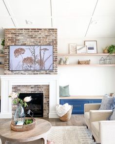 a living room filled with furniture and a flat screen tv mounted above a fire place