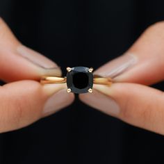 Product Details Look stylish while flaunting this Black Onyx Solitaire Ring adorned with a Cushion Shape Black Onyx in 4 prong setting while a hidden Round Shape Diamond graces its shank in bezel setting. Gift this stunning Solitaire Ring crafted in Solid Gold to your better half on a special day and win her heart right away. Product Information SKU SHP-RINGS122040918 Width 7 mm Height 8.5 mm Weight 2.64 gm (Approximate) BLACK ONYX INFORMATION No.of Stones 1 Pieces Total Weight 2.10 Carat (Appro Black Stone Ring, Signature Jewelry, 18k Yellow Gold Ring, Better Half, Ring Crafts, Black Spinel, Timeless Jewelry, Look Stylish, Conflict Free Diamonds