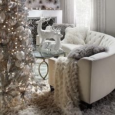 a living room with a white christmas tree