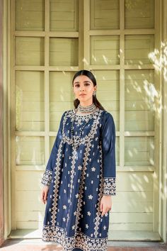 Pakistani Blue Dress in Frock Trouser Style for Eid is a traditional masterpiece to have a charismatic appearance on the festive occasion. This stunning Frock and Churidar is adorned with lavish designs and embroidery, making this attire your foremost priority to have a head-turning appearance. Frock: The beautiful Pakistani Frock in an alluring blue shade comes in premium cotton fabric. The beautifully stitched Pakistani Blue Dress is adorned with graceful embroidery work and threads. Floral de Reception Dresses With Intricate Embroidery For Festivals, Eid Dress With Intricate Embroidery In Raw Silk, Eid Raw Silk Dress With Intricate Embroidery, Festive Reception Dress With Zari Work, Raw Silk Dress With Zari Work For Navratri, Unstitched Dress With Intricate Embroidery For Navratri, Bollywood Style Dress For Eid Reception, Bollywood Dress For Eid Reception, Intricate Embroidery Dress For Eid Reception