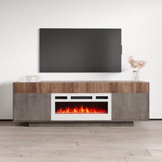 an entertainment center with a fireplace in the middle and a flat screen tv above it