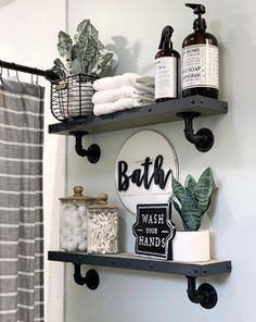 a bathroom with two shelves holding various items