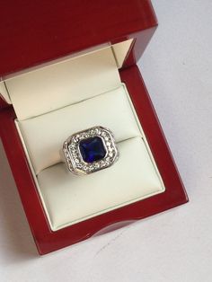 Antiques Art Deco Style Silver Blue Sapphire Glass Ring Un grande anello essenziale ed elegante. Argento, un grande zaffiro blu in vetro e tanti piccoli strass. Condizioni come da foto Accessori non compresi Modern Blue Sapphire Ring For Formal Occasions, Elegant Royal Blue Sapphire Ring Gift, Elegant Royal Blue Sapphire Ring As Gift, Formal Sapphire Crystal Ring, Sapphire Crystal Diamond Ring For Formal Occasions, Formal Sapphire Crystal Ring With Diamond, Modern Blue Diamond Ring Gift, Blue Rectangular Diamond Ring For Formal Occasions, Modern Blue Diamond Ring As Gift