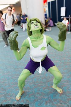 a woman dressed as the hulk in an airport