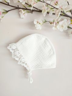 ♡ Baby bonnet made from ecru muslin and embroidered cotton lace. Would be perfect for baptism or christening. ♡ MADE OF: Christening Bonnet is made of a 2 layers of ecru muslin.  ♡ Processing time is usually 5-7 days.  ♡ CARE INSTRUCTIONS: We recommend hand washing.  Do not use bleach. Dry at low temperatures, do not use machine drying. Iron at medium or low temperature. Adjustable Cotton Bonnet With Lace Trim, White Adjustable Lace Bonnet, White Lace Adjustable Bonnet, Adjustable Cream Bonnet For Baptism, White Cotton Bonnet For Baptism, Cream Cotton Baptism Dress, Lace Baby Bonnet, Newborn Bonnet, Muslin Baby