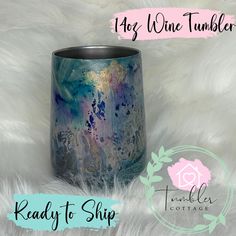 a blue and purple vase sitting on top of a white fur covered floor with the words ready to ship