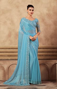 COLOR : Sky Blue FABRIC : Saree - Chiffon Silk, Blouse - Chiffon Silk & Net WORK : Resham Embroidery, Stones, Sequins, Lace BorderOCCASION : Wedding, Engagement, Party Wear, Festival, Sangeet NOTE : The outfit includes blouse and saree only. Petticoat is not included. READY-TO-WEAR : No STITCHING : Available as semi-stitched fabric, can be stitched using standard size option (+$30). Note: There might be a slight color variation due to lighting and flash used during photoshoot. The bright shade seen is the best closer view of fabric's color. Traditional Blue Organza Blouse Piece, Traditional Blue Organza Blouse, Blue Semi-stitched Organza Blouse Piece, Fitted Georgette Embroidered Fabric For Formal Occasions, Fitted Georgette Embroidered Fabric For Formal Wear, Fitted Blue Georgette Blouse Piece, Fitted Embroidered Georgette Fabric For Formal Wear, Fitted Blue Blouse Piece With Sheer Dupatta, Fitted Blue Blouse With Sheer Dupatta