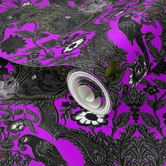 purple and black wallpaper with floral designs on it