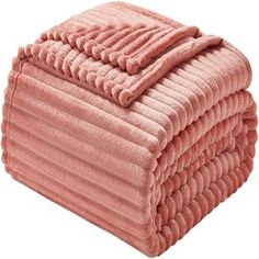 pink towels stacked on top of each other