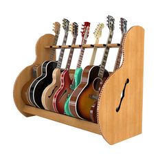 a wooden guitar rack with six guitars in it