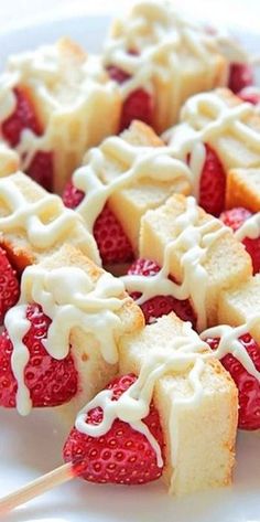 strawberry shortcakes with white icing and strawberries