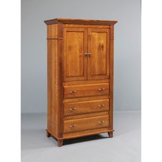 an old fashioned wooden armoire with drawers