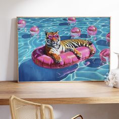 a painting of a tiger laying on an inflatable pool floater with pink floats