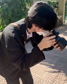 a person taking a photo with a camera