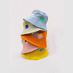 Studio Blinky x All Small Co Funny Shapes Bucket Hat | All Small Co – All Small Co. Playful Spring Bucket Hat, Playful Yellow Hats For Spring, Playful Yellow Hat For Spring, Trendy Multicolor Cotton Hats, Playful Yellow Spring Hat, Playful Multicolor Bucket Hat For Summer, Playful Multicolor Cotton Sun Hat, Playful Mini Cap Hats For Spring, Fun Yellow Bucket Hat For Spring