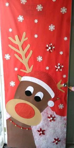 the door is decorated with reindeers and snowflakes