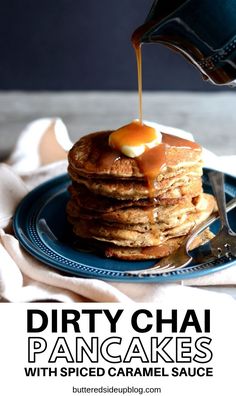 a stack of pancakes with syrup being drizzled on top and the words dirty chai pancakes with spiced caramel sauce