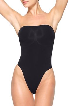 Sculpt and punctuate your natural curves with this strapless thong bodysuit that cinches your waist and supports your bust with strategic side and front stitching. The removable straps convert from straight to cross-back to halter style, making the piece versatile enough to wear under almost anything in your wardrobe. Snap closure Strapless 41% recycled nylon, 41% nylon, 18% elastane Machine wash, tumble dry Made in Turkey Strapless Bodysuit, Teddy Bodysuit, Shape Wear, Teddy Lingerie, Natural Curves, Halter Style, Free Fabric, Long Sleeve Bodysuit, Kim Kardashian