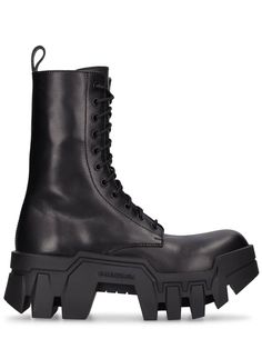 Round toe. Front lace-up closure. Back pull loop. Embossed logo detail. Treaded rubber outsole Balenciaga Boots, Black Balenciaga, Balenciaga Women, Balenciaga Logo, Miu Miu Shoes, Leather Lace Up Boots, Heeled Loafers, Platform Boots, Embossed Logo