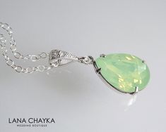 Wedding Swarovski Mint Green Opal Light Green Pastel Green Color Teardrop Crystal Rhinestone Pendant with .925 Sterling Silver Chain Necklace. LANA CHAYKA SHOP: https://www.etsy.com/shop/LanaChayka?ref=seller-platform-mcnav Classy and elegant, this necklace would be perfect for any wedding or occasion! CHAIN is 18 inches (45.7 cm) long, PENDANT is about 1 inch (2.5 cm) long including bail. MATCHING EARRINGS: https://www.etsy.com/listing/188438477/chrysolite-opal-crystal-earrings-light?ref=shop_h Green Pastel, Wedding Pendant, Art Deco Necklace, Green Jewelry, Sterling Silver Chain Necklace, Bridesmaid Wedding, Green Opal, Wedding Jewellery Necklace, Long Pendant