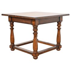 an old wooden table with two legs and a square top on the bottom, against a white background