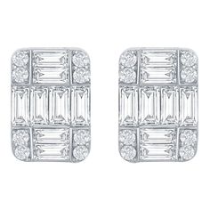 Emerald cut illusion earrings set in 18K white gold. The total carat weight of the earrings is 3.52 carats. The earrings are a cluster of baguette and round diamonds that create the illusion of a single emerald cut. The color of the stones are F, the clarity is VS1. Illusion Earrings, Thai Modern, Rectangular Earrings, Emerald Cut, Earrings Set, Jewelry Earrings Studs, Round Diamonds, Earring Set, Emerald