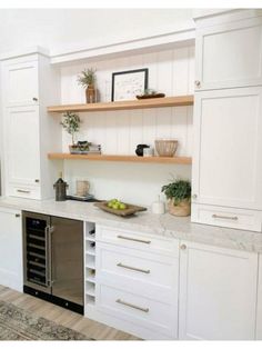 the kitchen is clean and ready to be used as a wine cellar or bar area