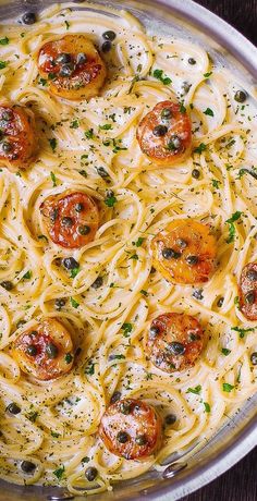 a pan filled with pasta covered in sauce and toppings