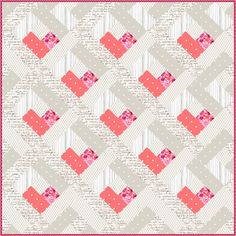 a pink and white quilt with squares on it