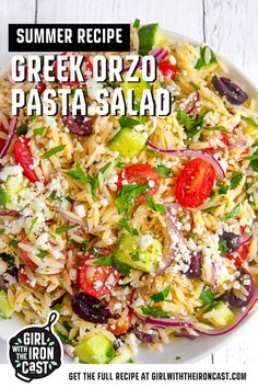 a white plate topped with pasta and veggies