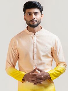 This Sunrise Shaded kurta set will instantly give an elegant look. This 2 piece kurta set features a Chanderi ombre shaded kurta with peach to yellow layer detail, a ghodi motif embroidery, front buttons fastening, and a mandarin collar. It is paired with narrow fitted pajama pants in cream color and malai cotton fabric. An ideal outfit for traditional occasions, and special events.

Size Chart For Men





	
	
					Men's Size Chart
		

		
		
						
				Size Chart For Men
				Custom Size Measure Spring Orange Straight Kurta, Designer Wear Straight Kurta In Peach, Festive Peach Straight Kurta, Peach Kurta With Zari Work And Long Sleeves, Peach Kurta With Zari Work, Peach Long Sleeve Kurta With Zari Work, Long Sleeve Peach Kurta With Zari Work, Long Sleeve Peach Kurta For Festive Occasions, Peach Long Sleeve Kurta For Festive Occasion