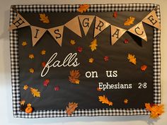 a bulletin board decorated with fall leaves and the words, his grace falls on us ephesians 28