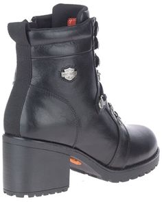 a pair of black leather boots with chains on the side and an orange soled heel