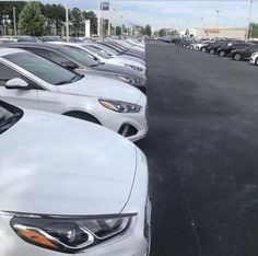 a row of cars parked in a parking lot