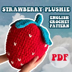 a crocheted strawberry is shown in the sky