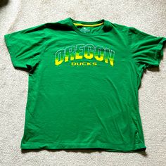 - Oregon Ducks - Green With Yellow - Mens Size Xl - 27 1/2” From Back Of Neck To Bottom - 24” From Armpit To Armpit - New Without Tags Oregon Ducks, Ducks, Green Yellow, Oregon, Colorful Shirts, Man Shop, Tags, Yellow, Green