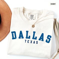 Our handmade Dallas Texas tshirts ship the same or next business day and are made to order just for you! Our trendy Dallas Trip shirts are made from an ultra soft 50/50 blend which will quickly make this your go to Basketball Fan long sleeve! We print all our threads with 100% eco-friendly water based ink. This means our ink is PVC free, safer to wear, and more sustainable for the environment. This makes all our garments both incredibly breathable and super long lasting! ♥Details♥ - 50/50 blend premium sweatshirt - Hand pressed with eco-friendly water-based ink ♥ Sizing ♥ -All our sweatshirts are unisex sizing.  -For a more fitted look, we recommend ordering your normal size. -If you prefer a baggy/oversized look then we recommend sizing up! - Check the sizing chart for exact dimensions ♥ Cotton School Spirit T-shirt, School Spirit Cotton T-shirt For Everyday, Cotton T-shirt With School Spirit For Everyday, Crew Neck T-shirt With School Spirit, Dallas Baptist University, Dallas Basketball, Trip Shirts, University Sweatshirts, Group Shirts