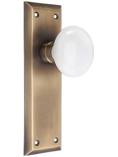 an image of a door handle with a white ball on it