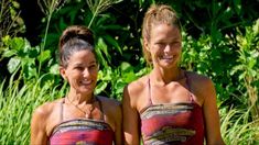 two women in bathing suits standing next to each other