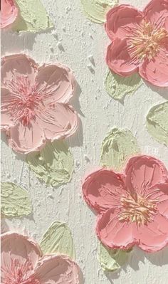 some pink flowers on a white wall and one is painted with acrylic paint