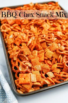 a baking pan filled with chex snack mix