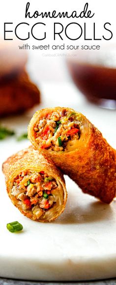 an egg roll is cut in half and sitting on a plate with the words, homemade egg rolls with sweet and sour sauce