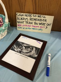 there is a sign on the table next to a basket with an egg in it