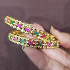 * Handcrafted Gold Plated Bangle Set * High Quality 22 K Gold Plated 2 pc Kids bangle set; * Available Sizes- 1.10, 1.12, 1-14 and 2.0 * Sold as a set of 2 bangles The gorgeous gold-plated bangle/ bracelet best exemplifies the careful craftsmanship done on it -- a specialty at Nemali Jewelry. It has a special tone of elegance attached to it. The intricate handmade design of the bangle/bracelet set gives it a fresh and original look. Look your best with this elegant-looking bangle / bracelet set Multicolor Stone Work Bracelets As Gift, Green Stone Setting Bangle As Gift, Multicolor Stone Bangle As Gift, Multicolor Stone Bangle For Gift, Multicolor Stone Setting Bangle Jewelry, Multicolor Stone Setting Bangle Bracelet, Green Stone Setting Bangle For Gift, Multicolor Stone Work Bangle As A Gift, Festive Multicolor Gemstone Bracelets