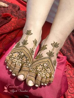 a woman's feet with hennap on it