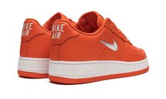 The Nike Air Force 1 Low Jewel “Orange” is a head-turning colorway of the classic basketball and lifestyle shoe with a mostly monochromatic orange design.  This version of the legendary Air Force 1 features an orange leather build with a contrasting Jeweled Swoosh on the sides.  Throwback “Nike Air” branding is embroidered on the heel and “Air Force 1” detailing is printed on the tongue tag.  A small white Swoosh is stitched onto the vamp.  Underfoot, the shoe rides on a white rubber midsole wit Jewel Shoes, Jeweled Shoes, Orange Design, Nike Air Force 1 Low, Air Force 1 Low, Orange Leather, 40th Anniversary, Retro Color, The Vamps