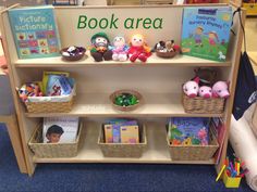 children's bookshelf with stuffed animals and baskets on the bottom shelf for reading